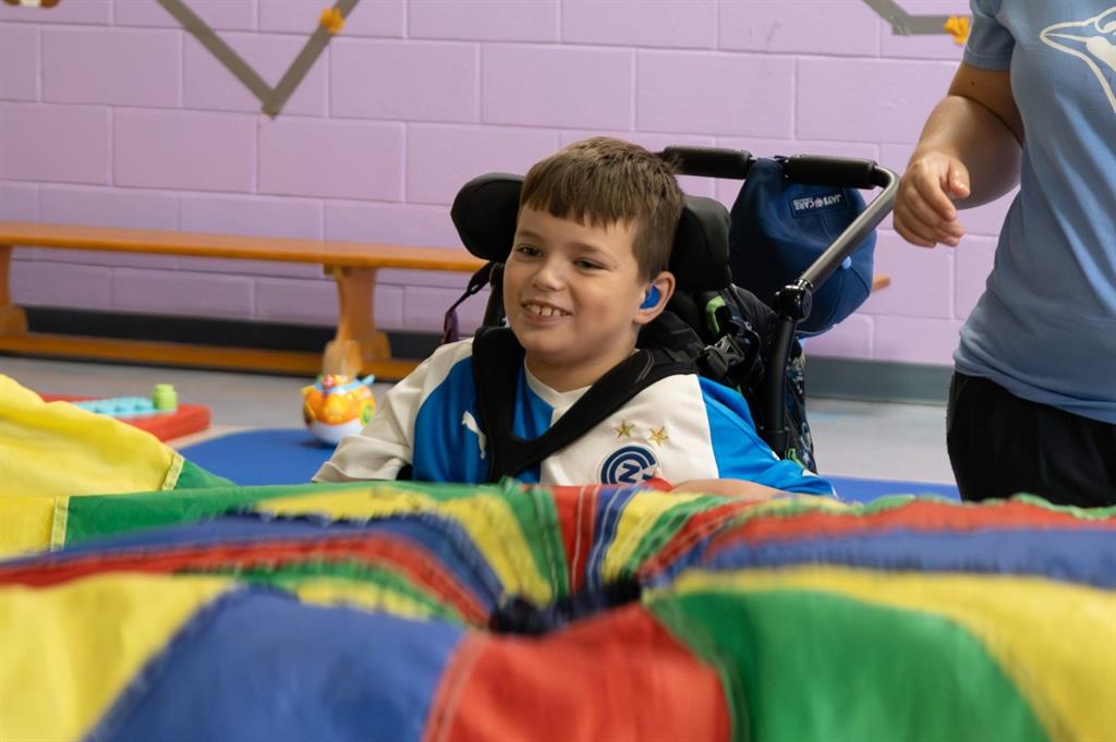 Boy participating in parachute game
