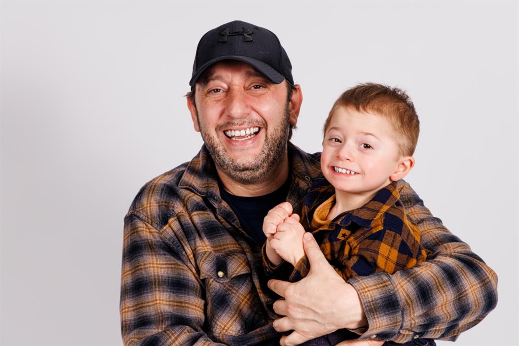 A father holding his son