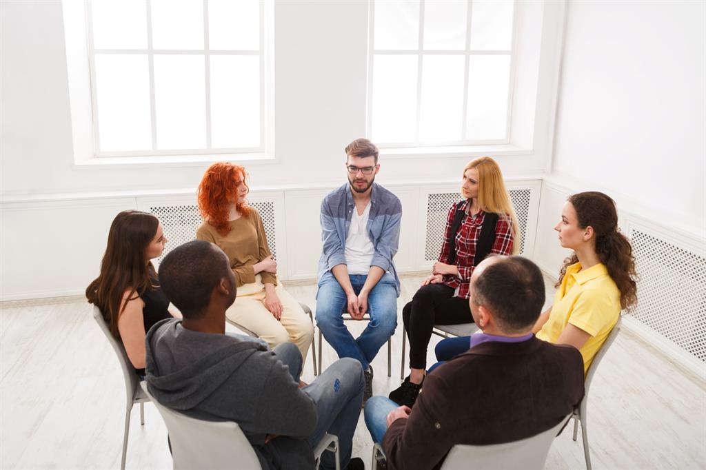 Parents gather in a room for a discussion