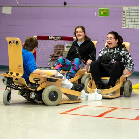 Children participating in Volt Hockey in a gymnasi