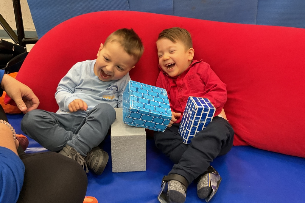 Two male children laughing