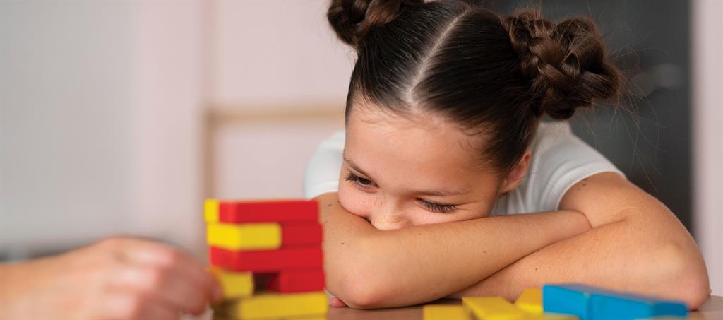 Young girl looking disengaged from activity