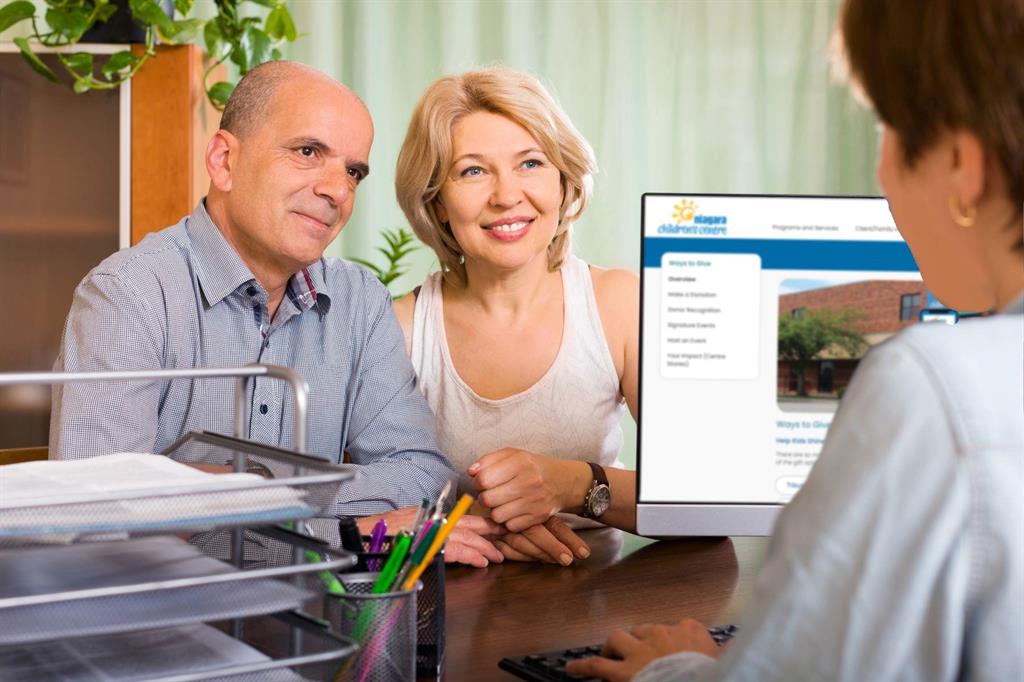 Aged couple speaking with an advisor